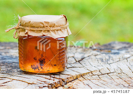 Bank with jam dandelion with copyspace Bank with jam dandelion with copyspace 45745187