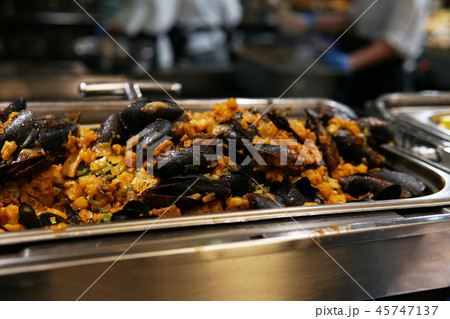 mussels baked with vegetables in the kitchen of the restaurant 45747137