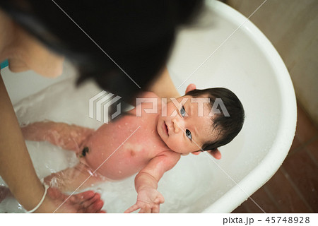Baby Taking A Shower With Her Mom Stock Photo