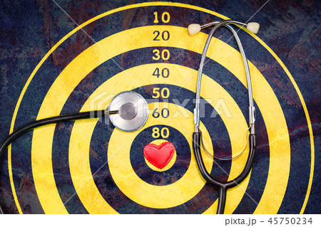 Red heart on dartboard with crack and stethoscope Red heart on dartboard with crack and stethoscope 45750234