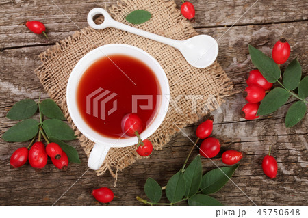 tea with rose hips on old wooden background. Top view 45750648