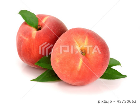 Two peaches with green leaf isolated on white background 45750662