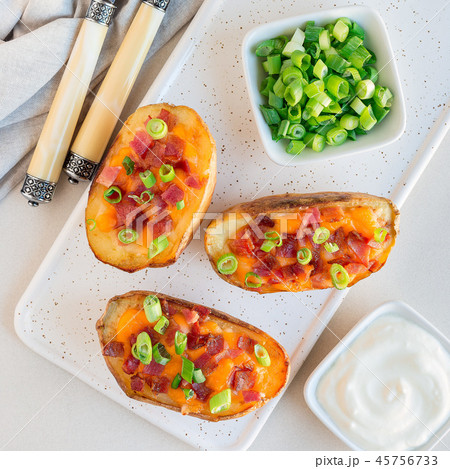 Baked potato skins with cheddar cheese and bacon 45756733