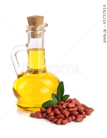 peanut oil in a glass bottle with peanuts 45757614