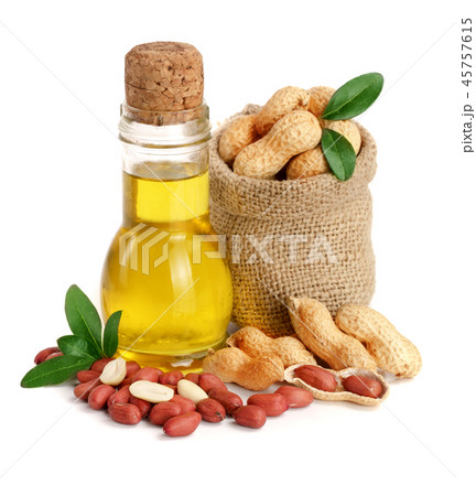 peanut oil in a glass bottle with peanuts in bag 45757615