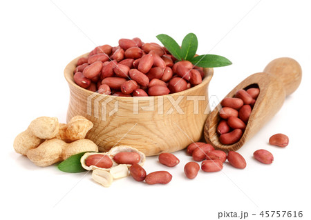 peanuts with leaf in wooden bowl isolated on white background 45757616