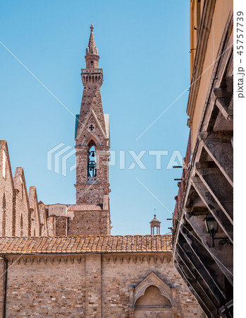 High narrow tower with bell in the Florence town 45757739