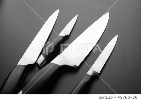 Collection of kitchen knives on black bfckground 45760720
