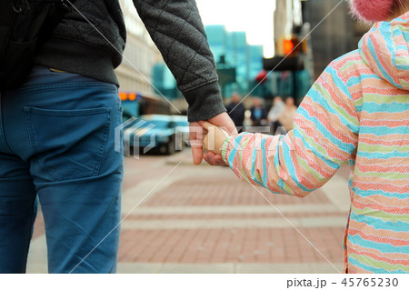 father holding the daughter hand, traffic lights 45765230