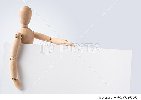 wooden mannequin hold empty board 45769060