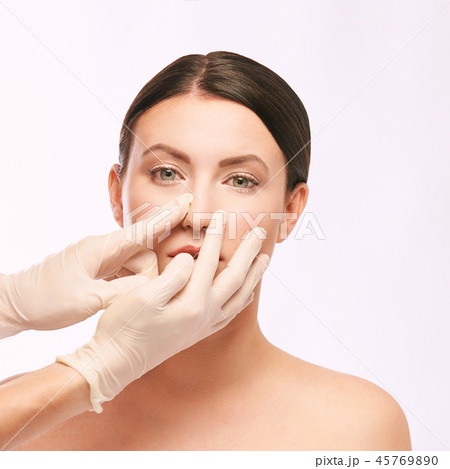 Plastic medical consultation. Doctor hands. Woman Plastic medical consultation. Doctor hands. Woman 45769890