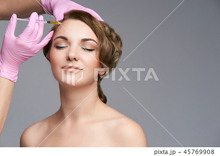 Young girl patient. Anti wrinkle filler injection. 45769908