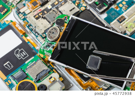 electronic chip in tweezers 45772938