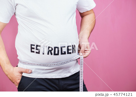estrogen level, overweight man with measuring tape 45774121