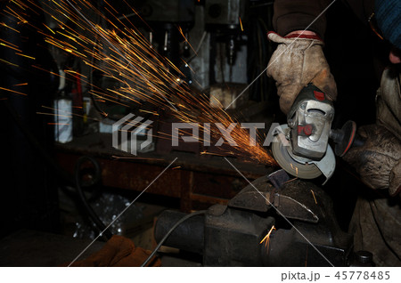 Angle grinder cutting steel with sparks Angle grinder cutting steel with sparks 45778485