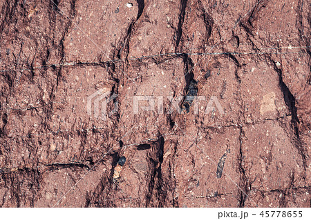 Red fractured stone surface background Red fractured stone surface background 45778655