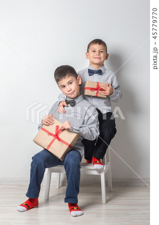 Two brothers are playing 45779770