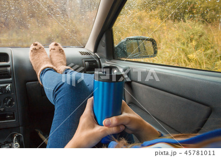 Woman legs in warm cute socks on car Woman legs in warm cute socks on car 45781011