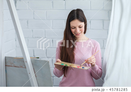 Beautiful woman draws 45781285