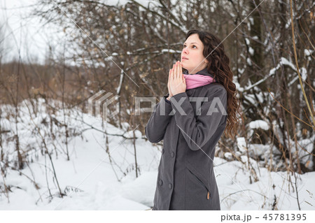 Beautiful girl praying Beautiful girl praying 45781395