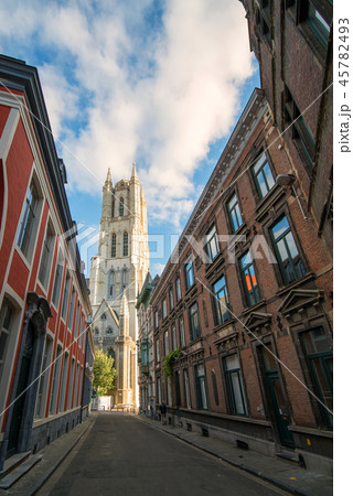 Beautiful narrow street of Ghent city, view to the Saint Bavo Cathedral 45782493