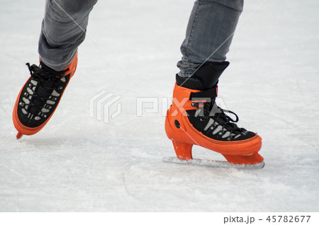 legs of man slipping on an ice christmas rink 45782677