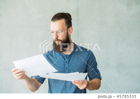 focused man read business documents information focused man read business documents information 45785335