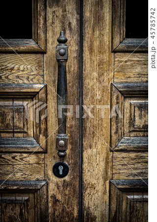 old wooden entrance door with antique door handle. old wooden entrance door with antique door handle. 45785742