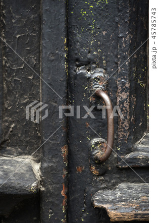 old wooden entrance door with antique door handle. old wooden entrance door with antique door handle. 45785743