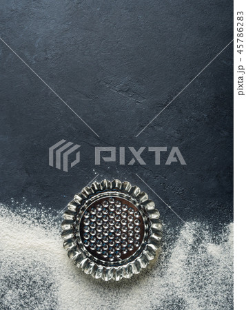 Baking accessories on black background with flour Baking accessories on black background with flour 45786283
