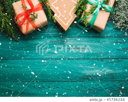 Christmas gift boxes on green background Christmas gift boxes on green background 45786288