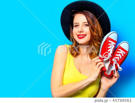 Woman with red gumshoes 45789561