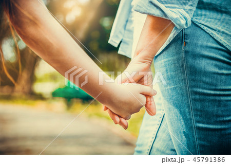 Happy mother and little kid daughter in park. Happy mother and little kid daughter in park. 45791386