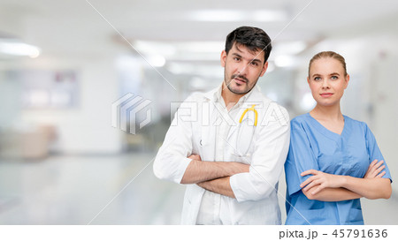 Doctors at hospital working with another doctor. 45791636