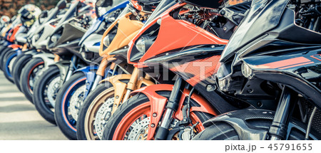 Motorcycles group parking on city street in summer Motorcycles group parking on city street in summer 45791655