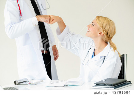 Happy doctor celebrates success with partner. Happy doctor celebrates success with partner. 45791694