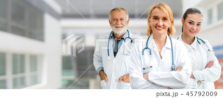 Doctor working in hospital with other doctors. 45792009