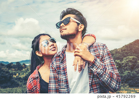 Happy couple take a romantic walk on the hills. 45792269