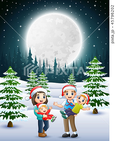 Happy familly in the snowy garden at night 45796202