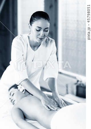 Beautiful woman lying on massage table and enjoying massage. 45798051