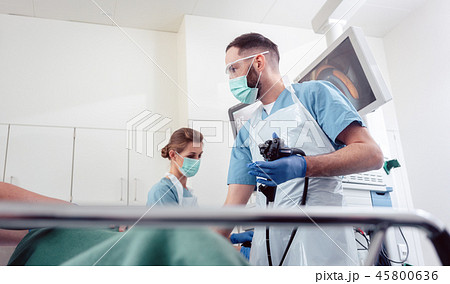 Team of doctors performing endoscopy in hospital Team of doctors performing endoscopy in hospital 45800636