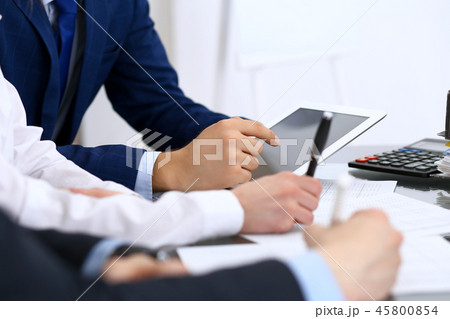 Bookkeepers team or financial inspectors making report, calculating and checking balance. Ta Bookkeepers team or financial inspectors making report, calculating and checking balance. Ta 45800854