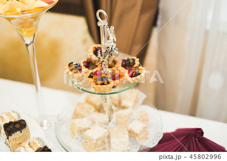 Delicious sweets on wedding candy buffet with desserts, cupcakes 45802996