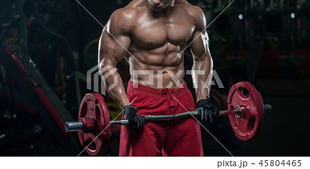 Muscular athletic bodybuilder fitness model posing 45804465