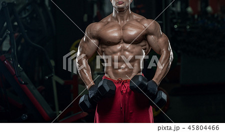 Muscular athletic bodybuilder fitness model posing 45804466