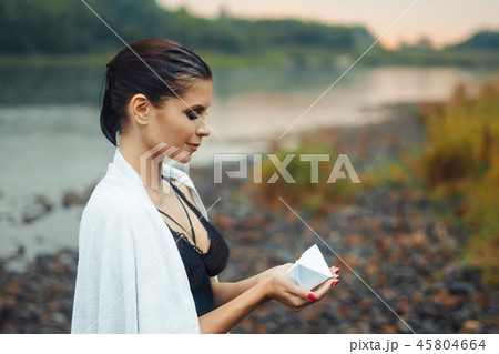 girl holding a paper boat 45804664