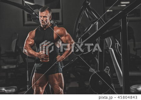Handsome man with big muscles, posing at the camer 45804843