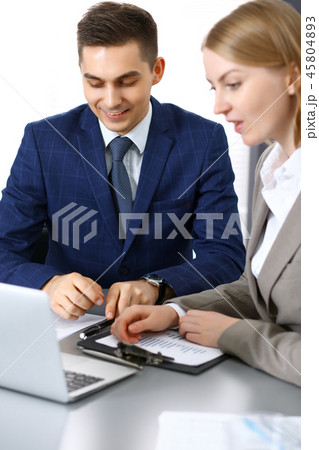 Business people using laptop pc while discussing project in office. Successful meeting and 45804893