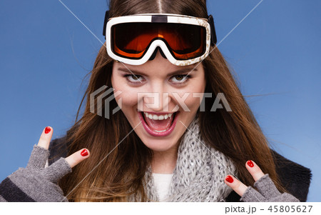 skier girl wearing warm clothes ski googles portrait. skier girl wearing warm clothes ski googles portrait. 45805627