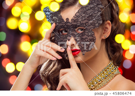 Beauty model woman wearing venetian masquerade carnival mask at party 45806474